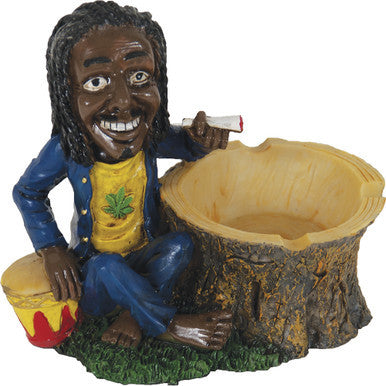 Jamaican Poly Resin Ashtray with reggae figurine sitting on a tree stump