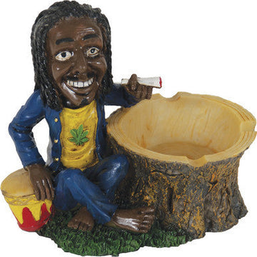 Jamaican Poly Resin Ashtray with reggae figurine sitting on a tree stump