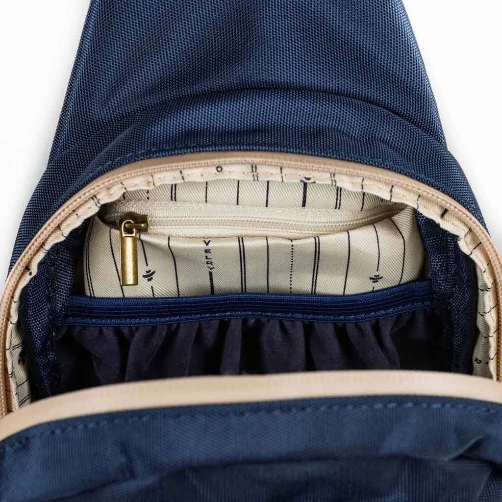 Interior view of the The Daytripper large smell proof crossbody bag showcasing its spacious compartment on a white background.