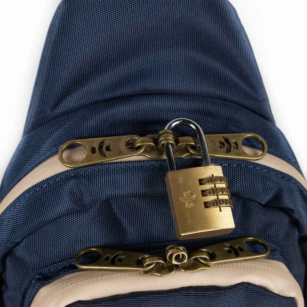 The Daytripper large smell proof crossbody bag in navy blue with a sturdy strap over a plain white background.
