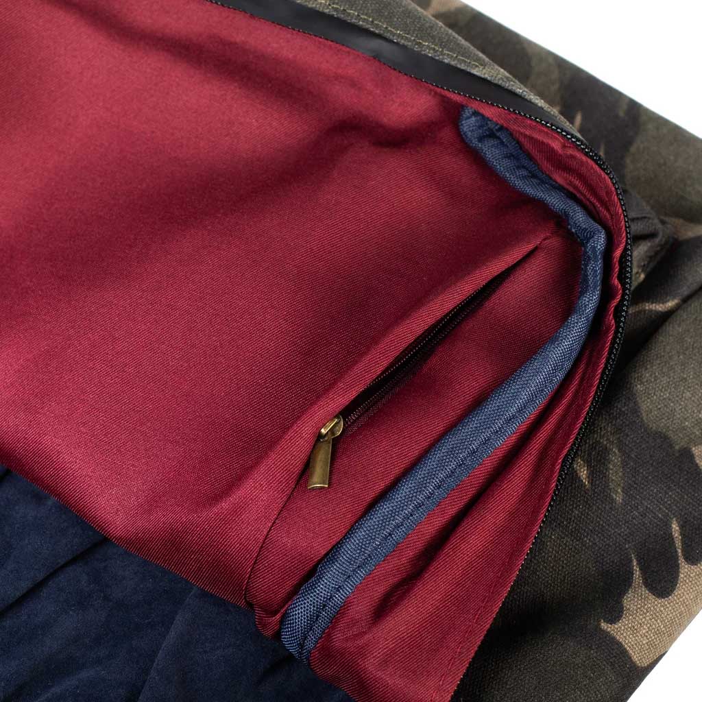 Full view of The Explorer Smell Proof Backpack in camo, featuring multiple compartments and durable zippers.