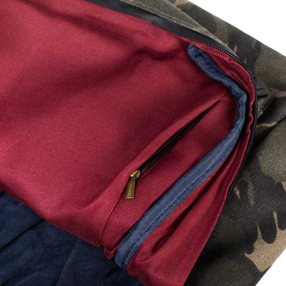 Full view of The Explorer Smell Proof Backpack in camo, featuring multiple compartments and durable zippers.
