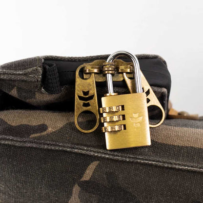 Open black Revelry Supply Drifter Backpack, displaying the inner compartment and rolled top.