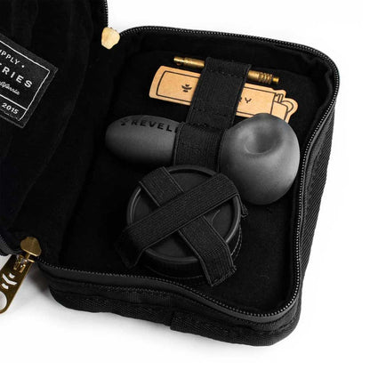 Inside view of the black Revelry Supply Smell-Proof Pipe Kit showcasing included items like a pipe and storage area.