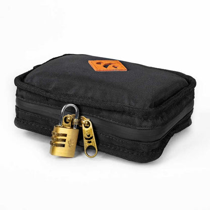 Close-up of the black Revelry Supply Smell-Proof Pipe showing its zipper closure and label detail.