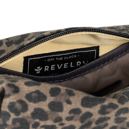 Leopard Revelry Supply The Cache Mini Smell Proof Toiletry Kit displayed with toiletries inside.