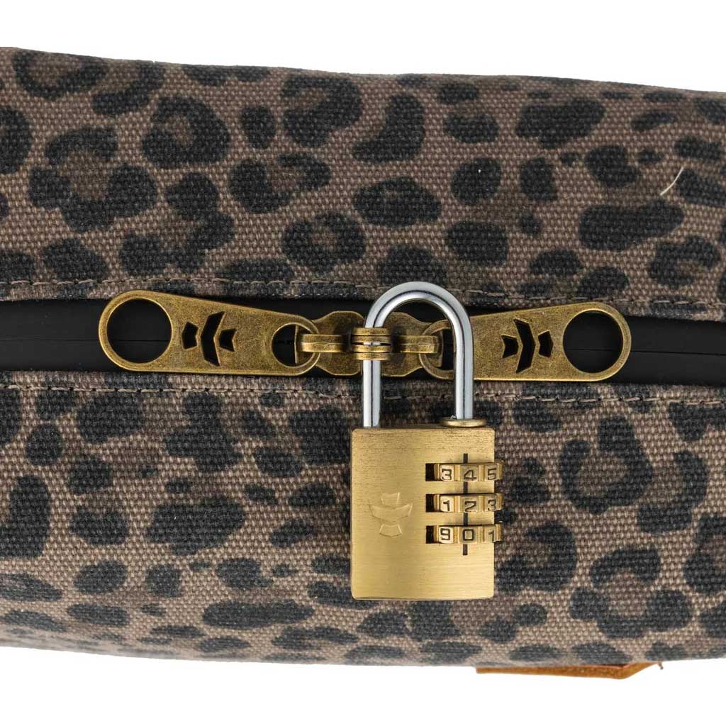 Open Leopard Revelry Supply The Cache showing interior compartments and zipper detail.