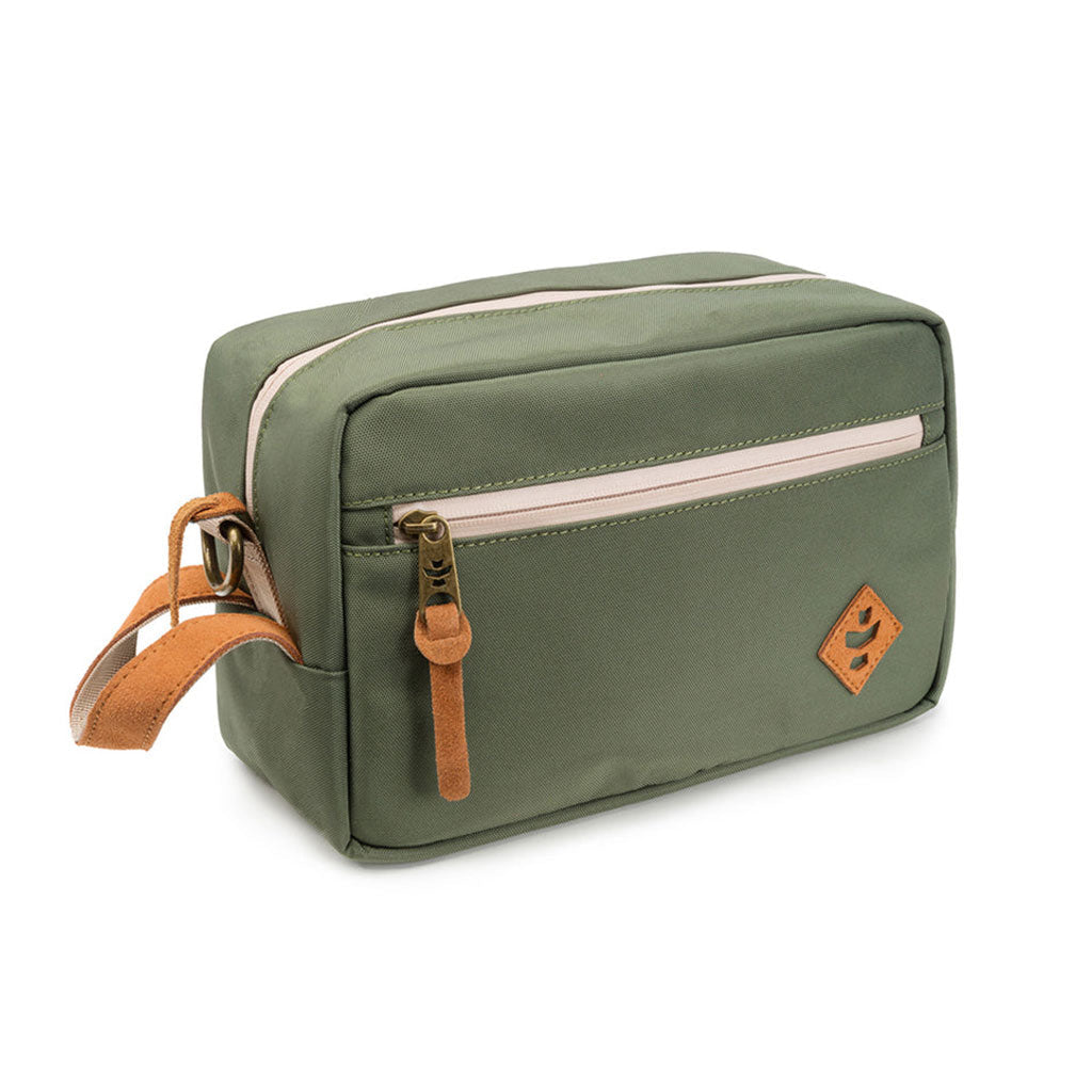 Green Revelry Supply Stowaway kit on a wooden table with a lifestyle setup.