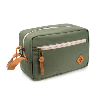 Green Revelry Supply Stowaway kit on a wooden table with a lifestyle setup.