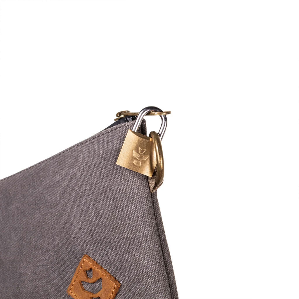 Close-up of the zippered opening of the black Revelry The Broker stash bag.