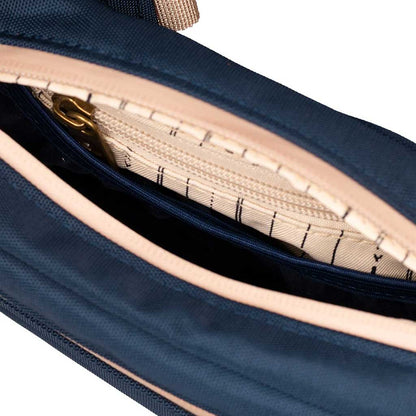 Side view of the Navy Blue Companion Smell Proof Crossbody Bag highlighting the adjustable strap.