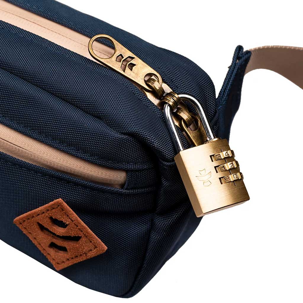 Close-up of the zipper compartment on the Navy Blue Companion Smell Proof Crossbody Bag.