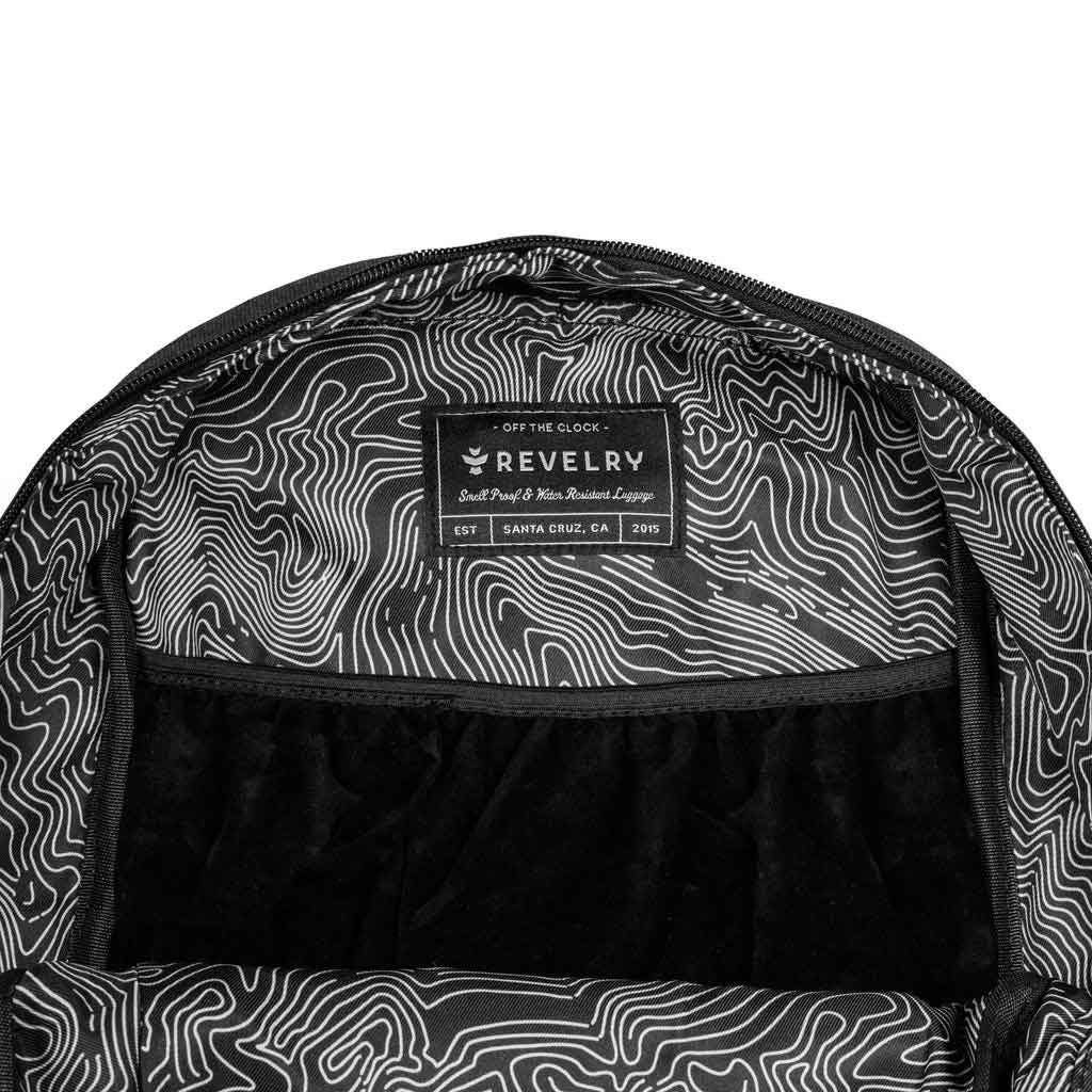 Open view of The Explorer Smell Proof Backpack in Smoke featuring spacious interior and compartments visible.